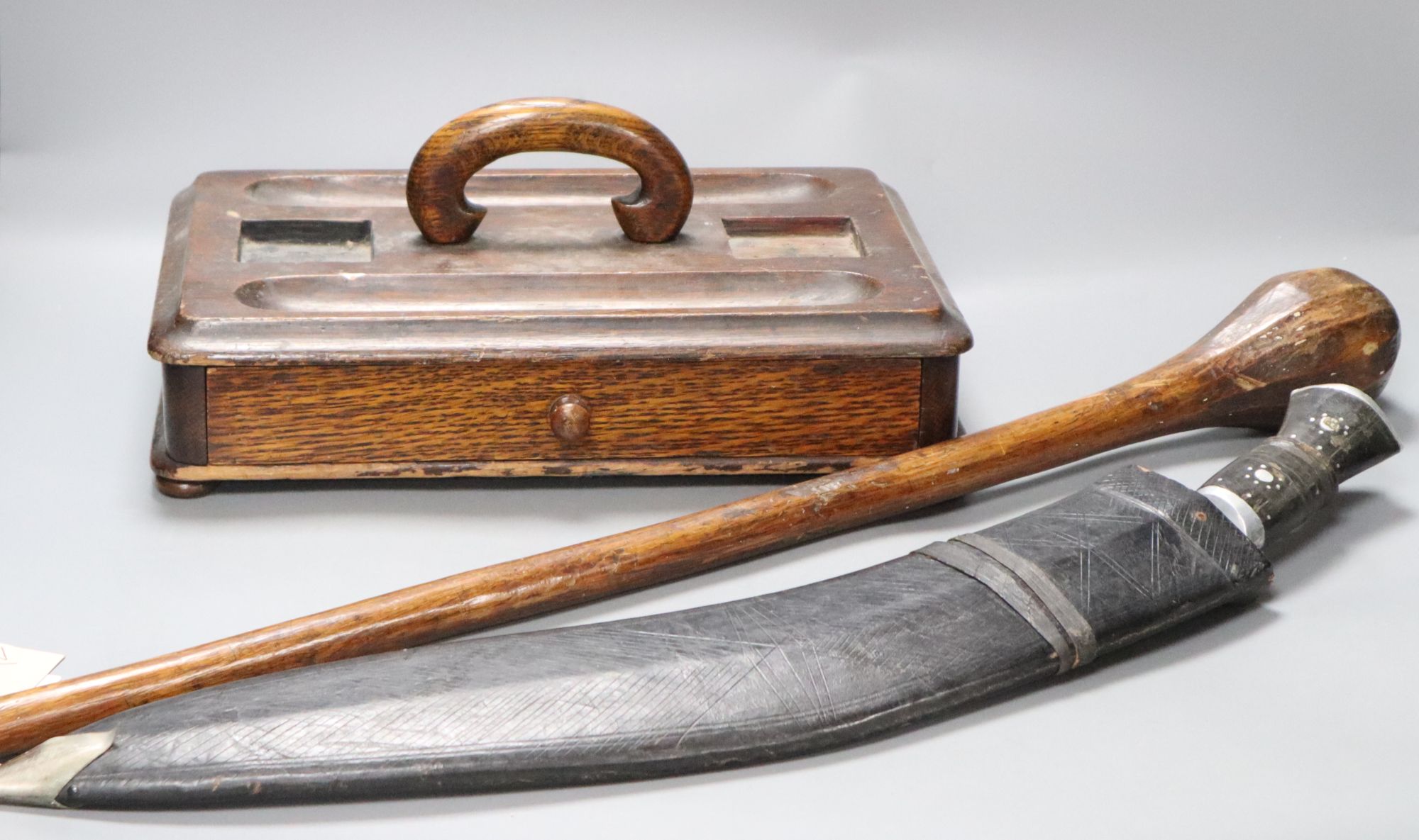 A kukri, an oak inkstand and a tribal throwing club